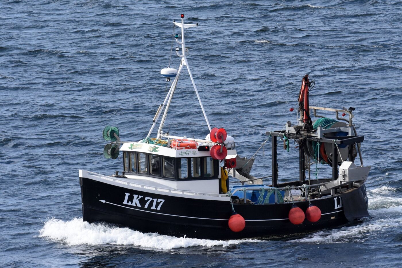 Fishing vessel Golden grain, Heading out past the Bressay lighthouse, at Bressay lighthouse, 31-08-2021